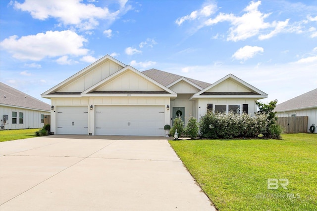 3973 Mercury Cir, Gulf Shores, AL 36542 - view of front of property with board and batten siding, driveway, and an attached garage