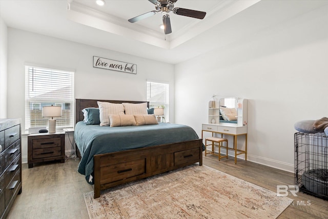 3973 Mercury Cir, Gulf Shores, AL 36542 - bedroom with wood finished floors, ornamental molding, a raised ceiling, recessed lighting, and a ceiling fan