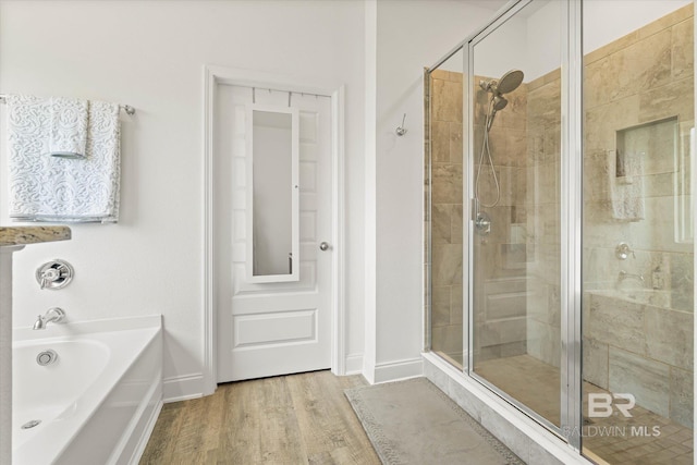3973 Mercury Cir, Gulf Shores, AL 36542 - full bath with a shower stall, a bath, and wood finished floors