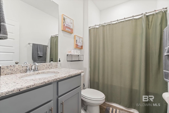 3973 Mercury Cir, Gulf Shores, AL 36542 - full bathroom with vanity, curtained shower, and wood finished floors
