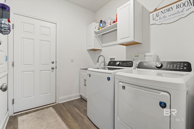 3973 Mercury Cir, Gulf Shores, AL 36542 - washroom featuring dark wood finished floors, washer and dryer, and cabinet space