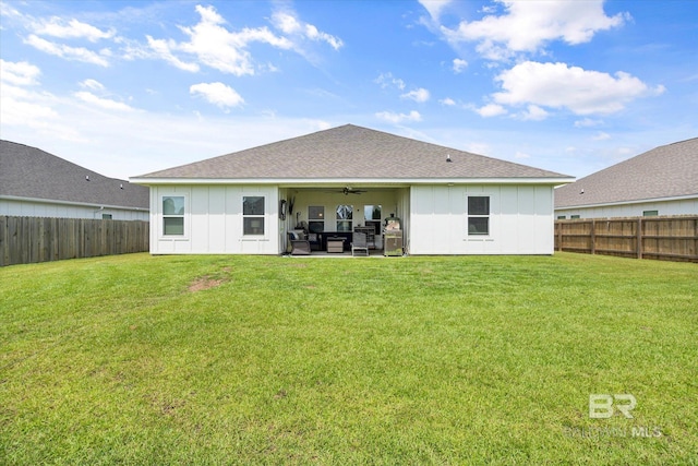 3973 Mercury Cir, Gulf Shores, AL 36542 - rear view of property featuring board and batten siding, ceiling fan, and a fenced backyard
