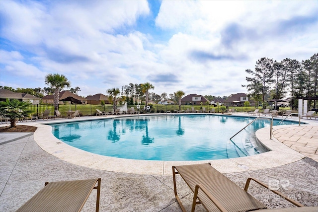 3973 Mercury Cir, Gulf Shores, AL 36542 - community pool featuring a patio and a residential view
