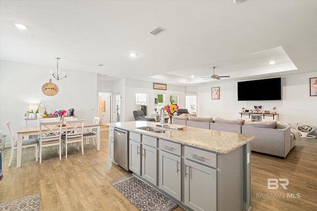 3973 Mercury Cir, Gulf Shores, AL 36542 - kitchen featuring dishwasher, gray cabinetry, a raised ceiling, recessed lighting, and light wood-type flooring