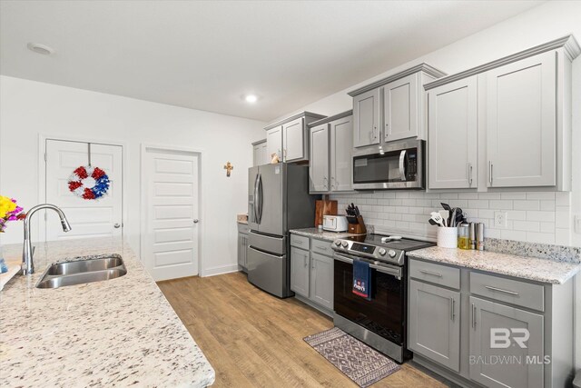 3973 Mercury Cir, Gulf Shores, AL 36542 - kitchen featuring stainless steel appliances, gray cabinets, decorative backsplash, and recessed lighting