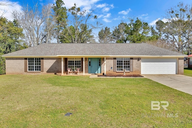 ranch-style house with a front yard, an attached garage, brick siding, and driveway