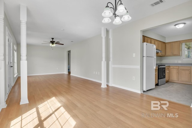 unfurnished living room featuring visible vents, baseboards, ceiling fan with notable chandelier, light wood-style floors, and ornate columns