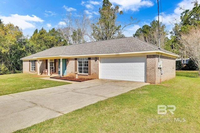 ranch-style home featuring a front lawn, an attached garage, brick siding, and concrete driveway