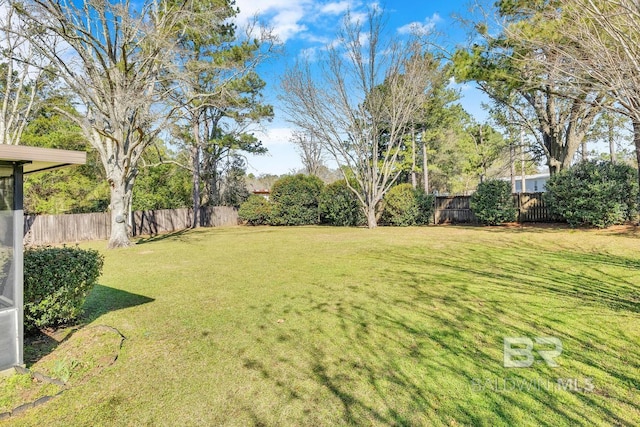 view of yard with a fenced backyard