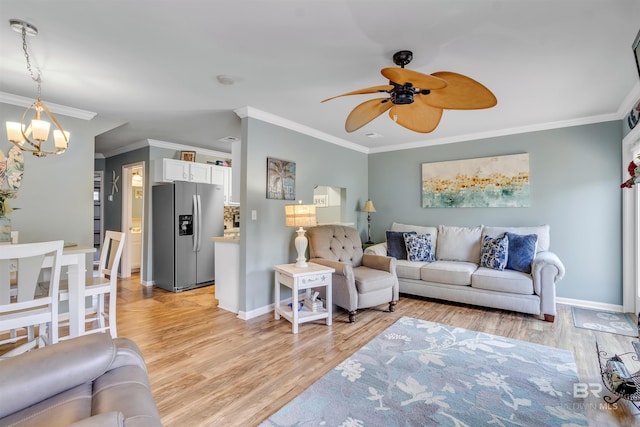 1517 Regency Rd Unit 121, Gulf Shores, AL 36542 - living room with ornamental molding, a chandelier, light wood-style flooring, a ceiling fan, and baseboards
