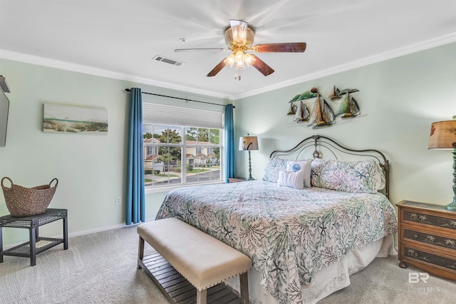 1517 Regency Rd Unit 121, Gulf Shores, AL 36542 - carpeted bedroom featuring ornamental molding, baseboards, and a ceiling fan