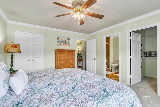 1517 Regency Rd Unit 121, Gulf Shores, AL 36542 - bedroom featuring a closet, carpet, ornamental molding, a ceiling fan, and ensuite bath