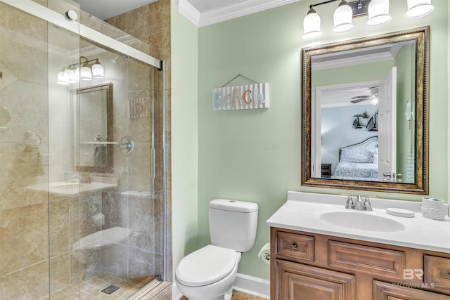 1517 Regency Rd Unit 121, Gulf Shores, AL 36542 - ensuite bathroom featuring toilet, crown molding, vanity, a stall shower, and baseboards
