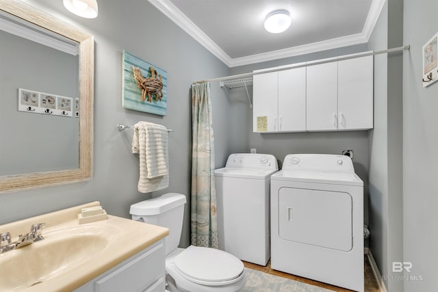 1517 Regency Rd Unit 121, Gulf Shores, AL 36542 - bathroom featuring washing machine and dryer, toilet, ornamental molding, vanity, and a shower with curtain