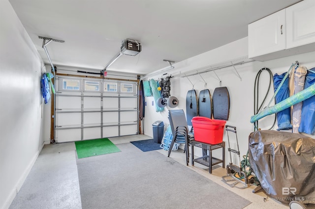 1517 Regency Rd Unit 121, Gulf Shores, AL 36542 - garage with a garage door opener and baseboards