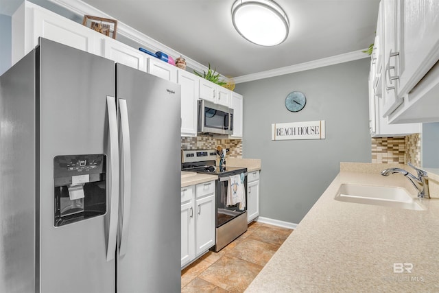 1517 Regency Rd Unit 121, Gulf Shores, AL 36542 - kitchen featuring appliances with stainless steel finishes, a sink, ornamental molding, backsplash, and light countertops