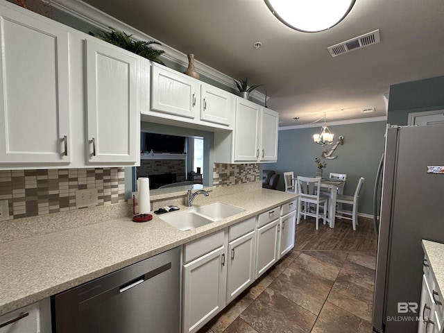 1517 Regency Rd Unit 121, Gulf Shores, AL 36542 - kitchen with stainless steel appliances, a sink, tasteful backsplash, crown molding, and white cabinets