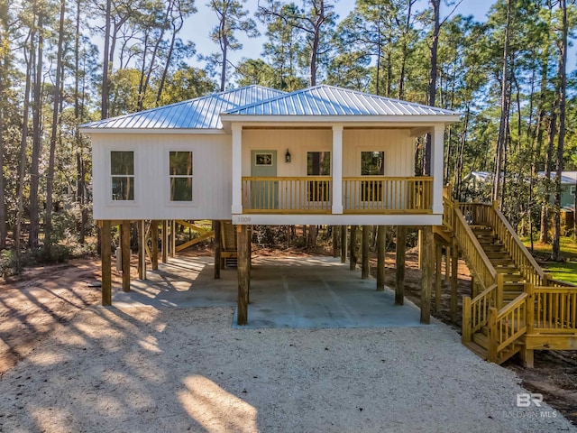 exterior space featuring a carport and covered porch