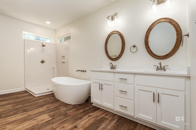 bathroom featuring vanity, separate shower and tub, and wood-type flooring