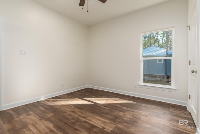 empty room featuring ceiling fan and dark hardwood / wood-style flooring