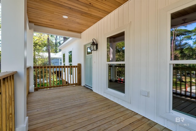 wooden terrace with a porch