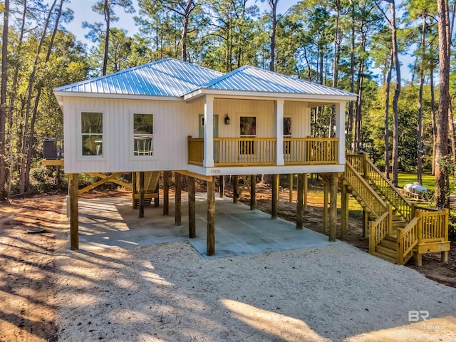 view of jungle gym with covered porch and central AC unit