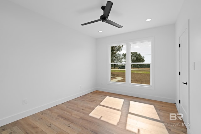 unfurnished room featuring ceiling fan and light hardwood / wood-style floors