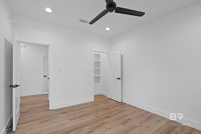 unfurnished bedroom featuring ceiling fan and light hardwood / wood-style flooring