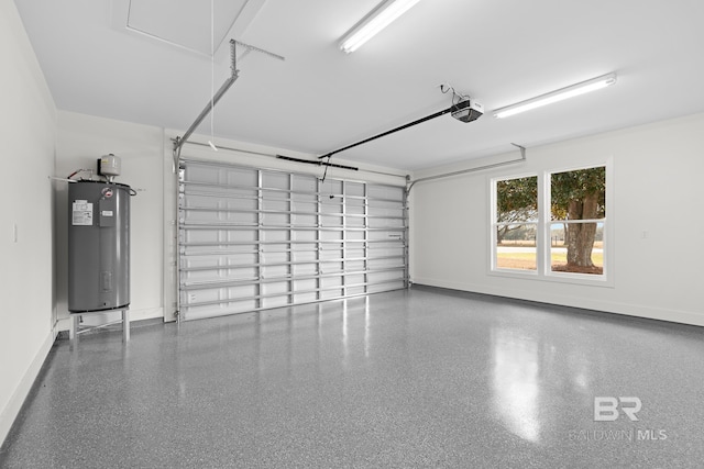 garage featuring a garage door opener and electric water heater