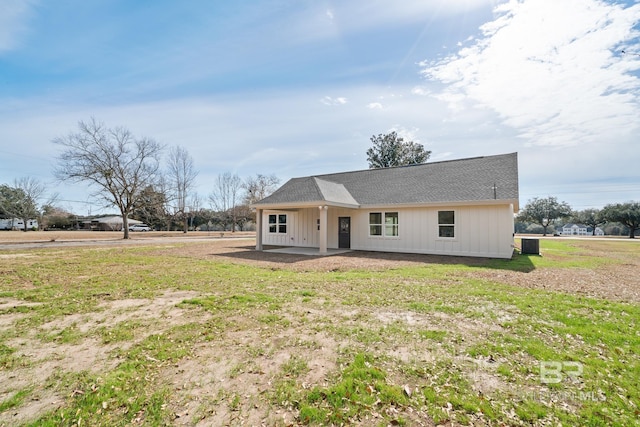 view of front facade with a front lawn and a patio