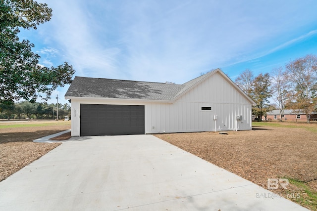 view of side of home featuring a garage