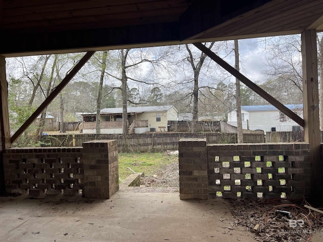 view of patio featuring fence