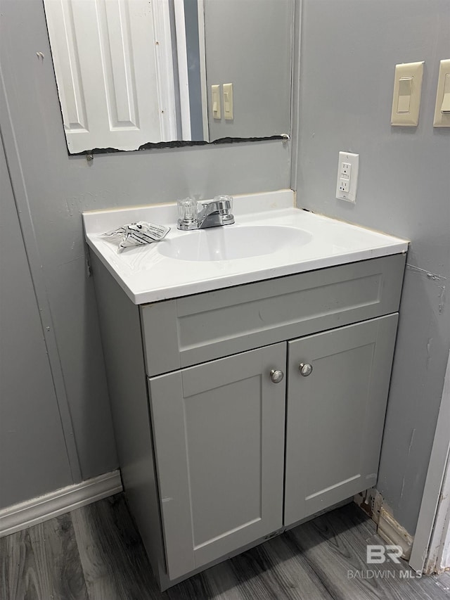 bathroom featuring wood finished floors and vanity