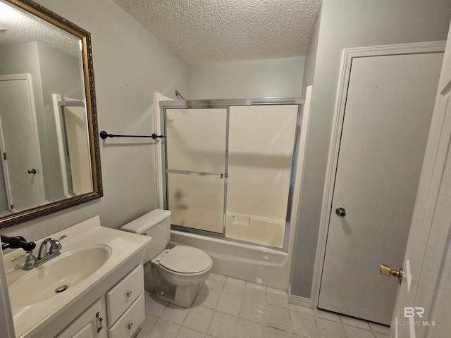 524 Linda Ln, Saraland, AL 36571 - full bath with a textured ceiling, vanity, toilet, shower / bath combination with glass door, and tile patterned floors