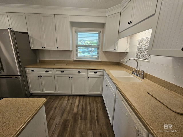 524 Linda Ln, Saraland, AL 36571 - kitchen featuring freestanding refrigerator, a sink, dishwasher, dark wood-type flooring, and decorative backsplash
