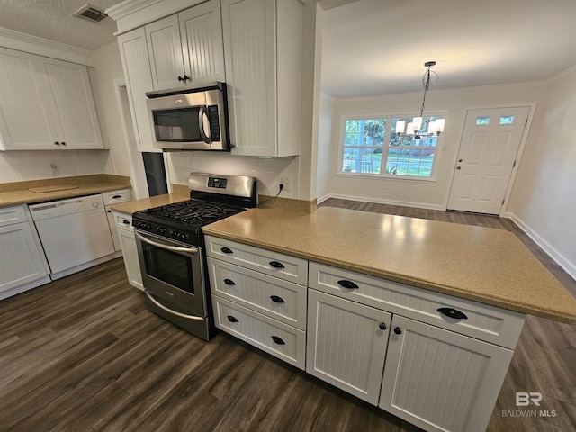 524 Linda Ln, Saraland, AL 36571 - kitchen featuring stainless steel appliances, dark wood finished floors, crown molding, a chandelier, and a peninsula