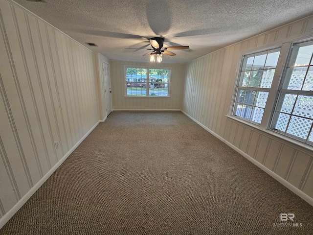 524 Linda Ln, Saraland, AL 36571 - carpeted empty room with a textured ceiling, a ceiling fan, and baseboards