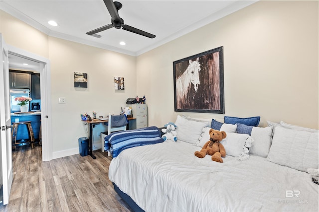 bedroom featuring crown molding, light wood finished floors, recessed lighting, ceiling fan, and baseboards