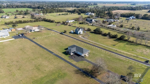 birds eye view of property featuring a rural view