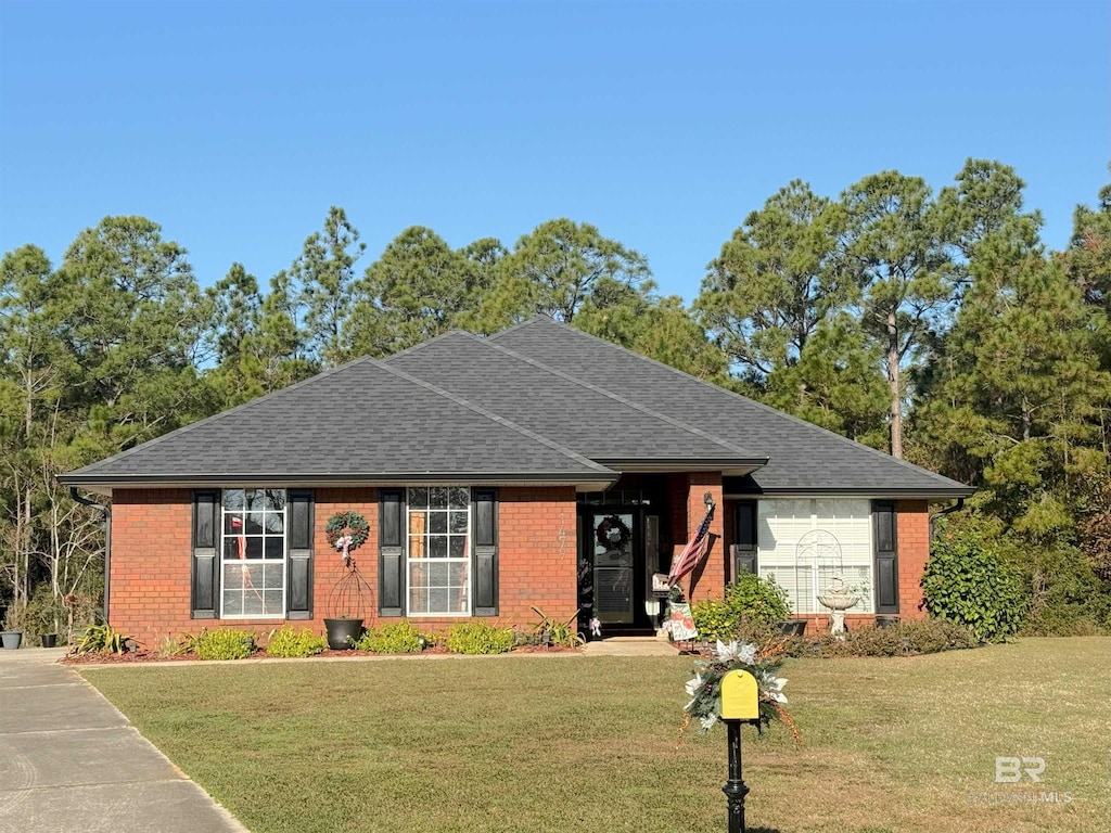 single story home with a front yard