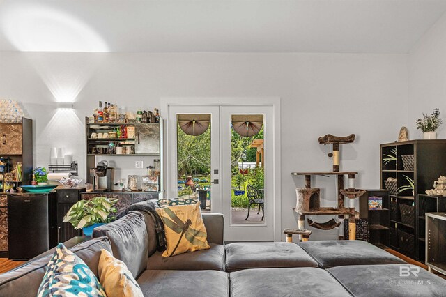 living room with hardwood / wood-style floors and french doors