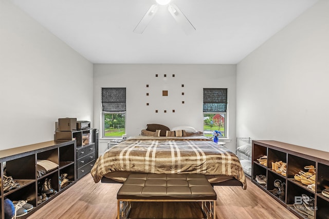 bedroom featuring wood finished floors and a ceiling fan