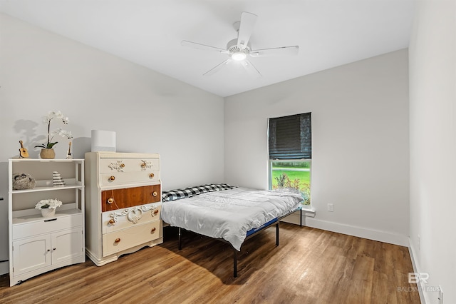 bedroom featuring ceiling fan and hardwood / wood-style floors