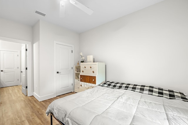 bedroom featuring ceiling fan and light hardwood / wood-style floors