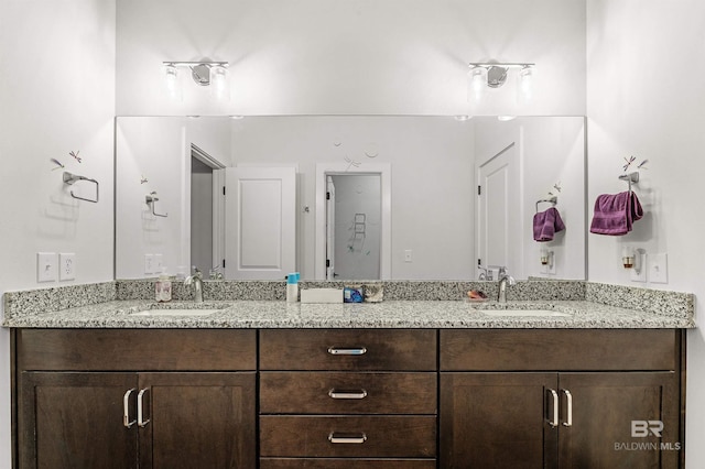 bathroom with double vanity and a sink