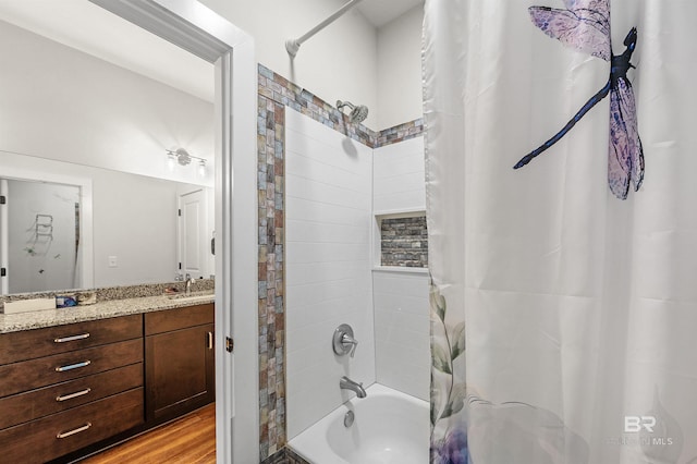 full bathroom featuring shower / tub combo, wood finished floors, and vanity