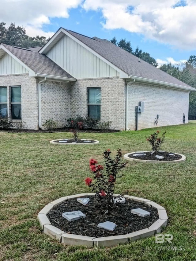 view of home's exterior featuring a yard