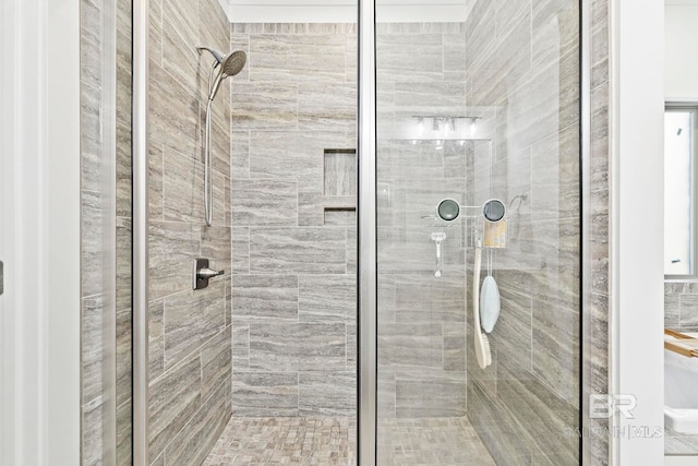 bathroom with a shower with shower door