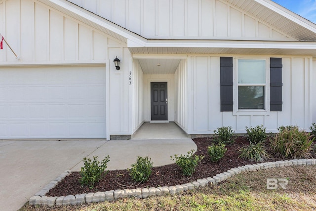 entrance to property with a garage and board and batten siding