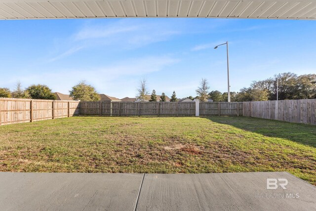 view of yard featuring a fenced backyard